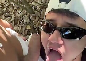 Transvestite having sex with a young man in the open air on the beach.